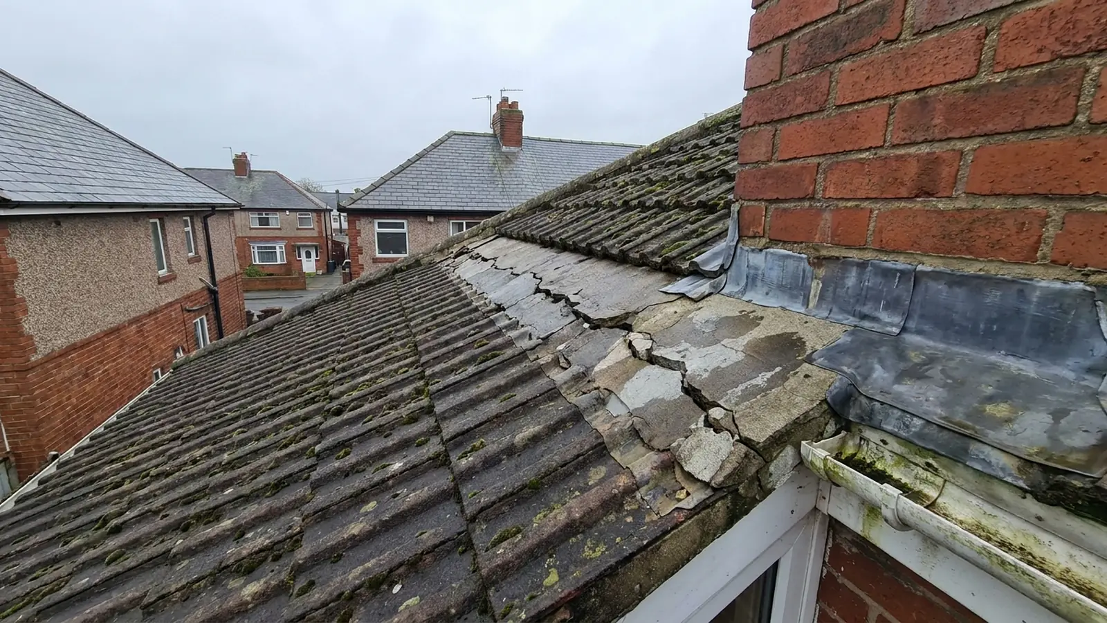 A cracked cement fillet at a roof abutment