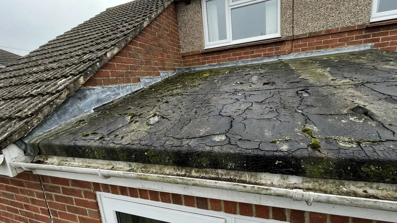 A felt roof with crazed and cracked surface