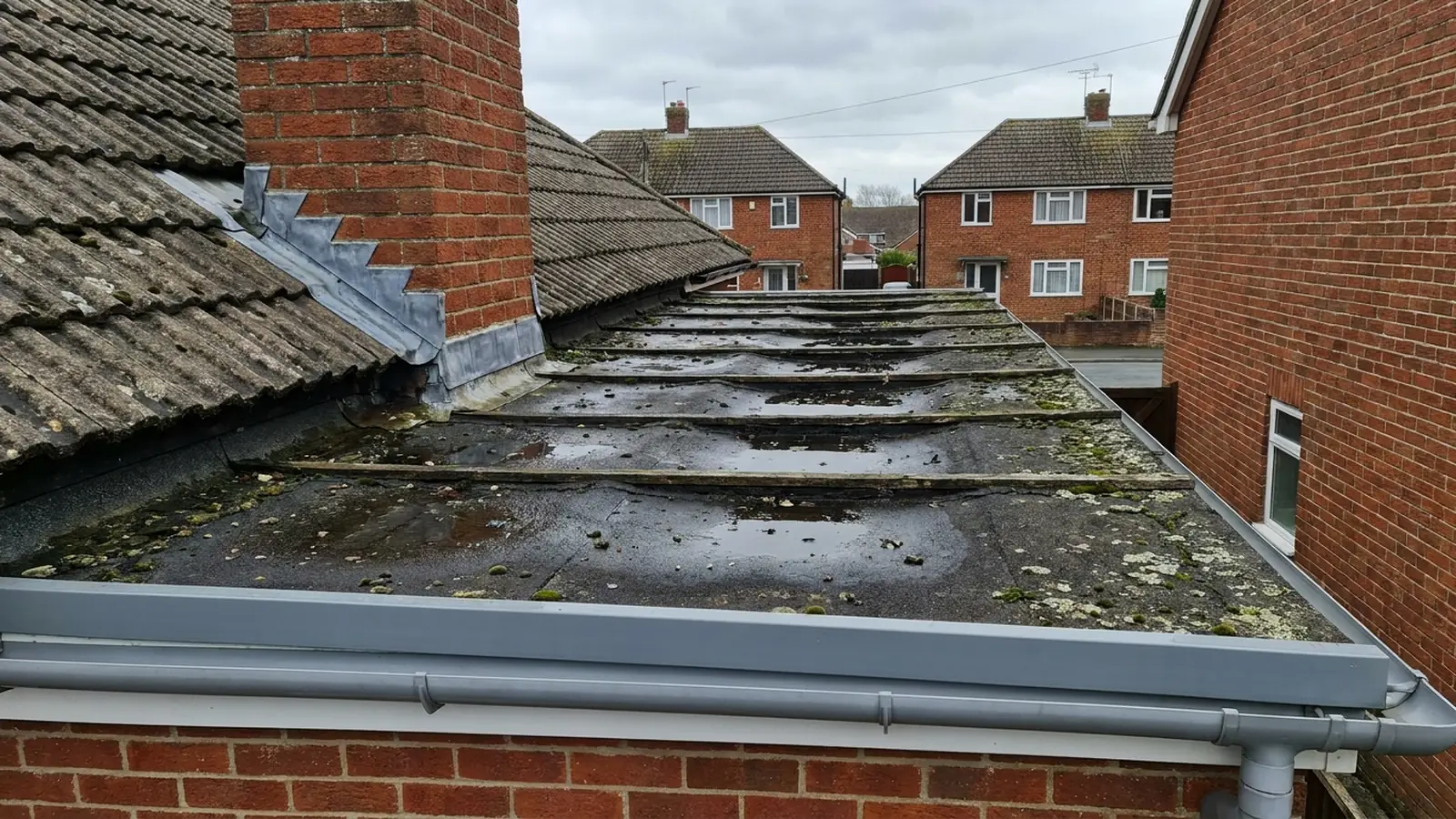 A flat roof deck sagging between joists