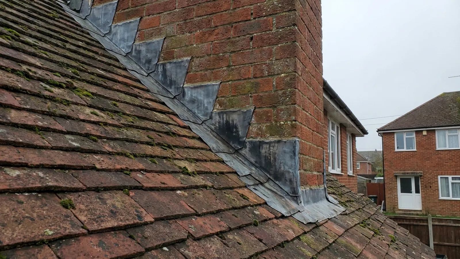 A roof abutment where a new roof meets a wall