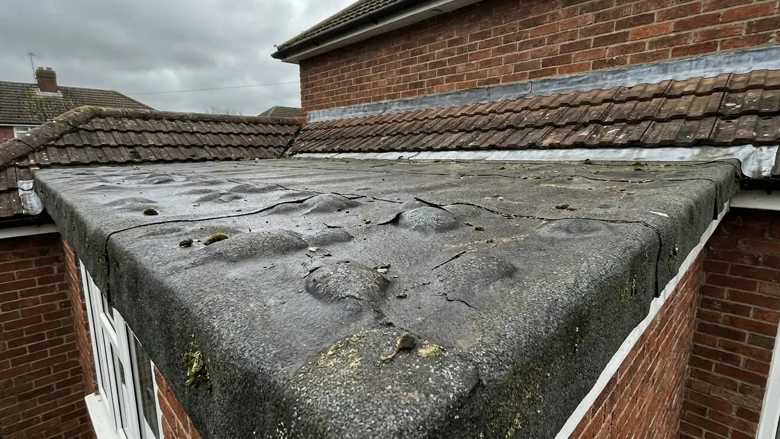 Blisters across a felt roof surface