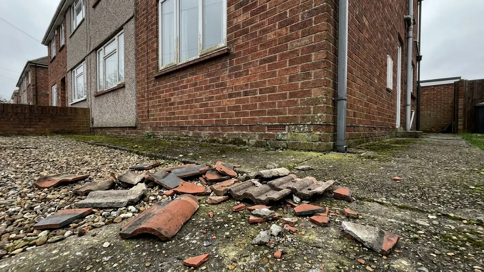 Broken tile fragments on a garden path