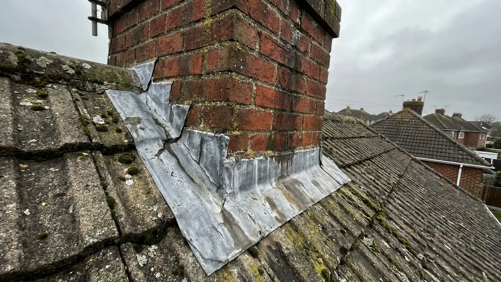 Failed lead flashing at the base of a chimney