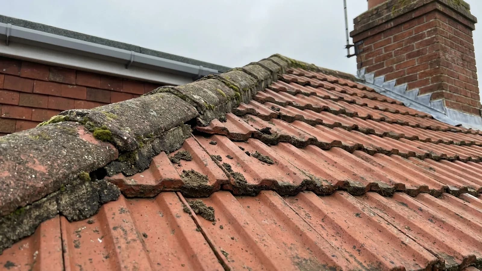 Gaps in the mortar along a roof ridge