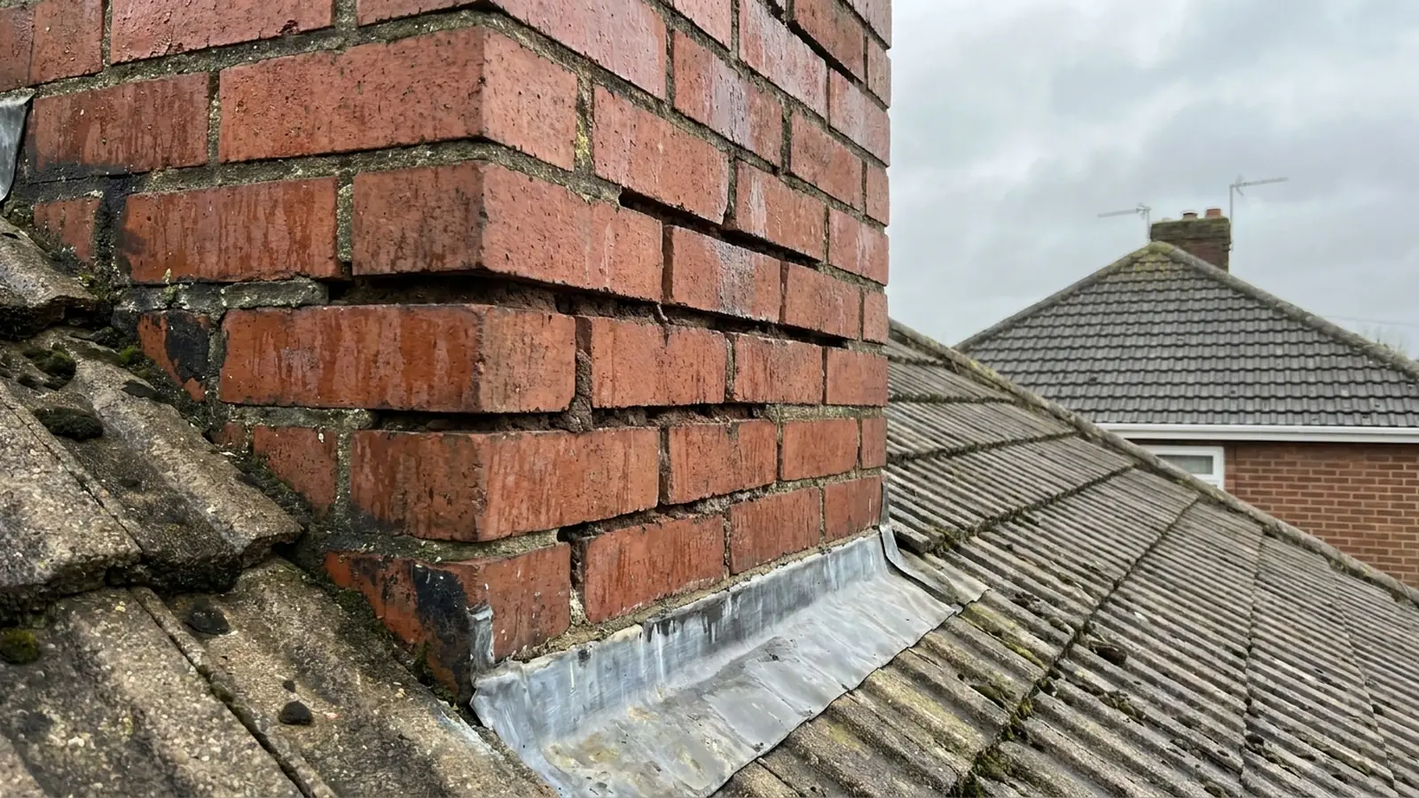 Open mortar joints in a chimney stack