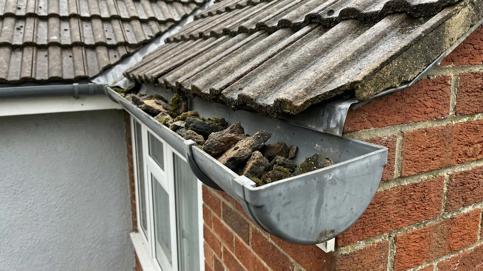 Pieces of mortar in a gutter