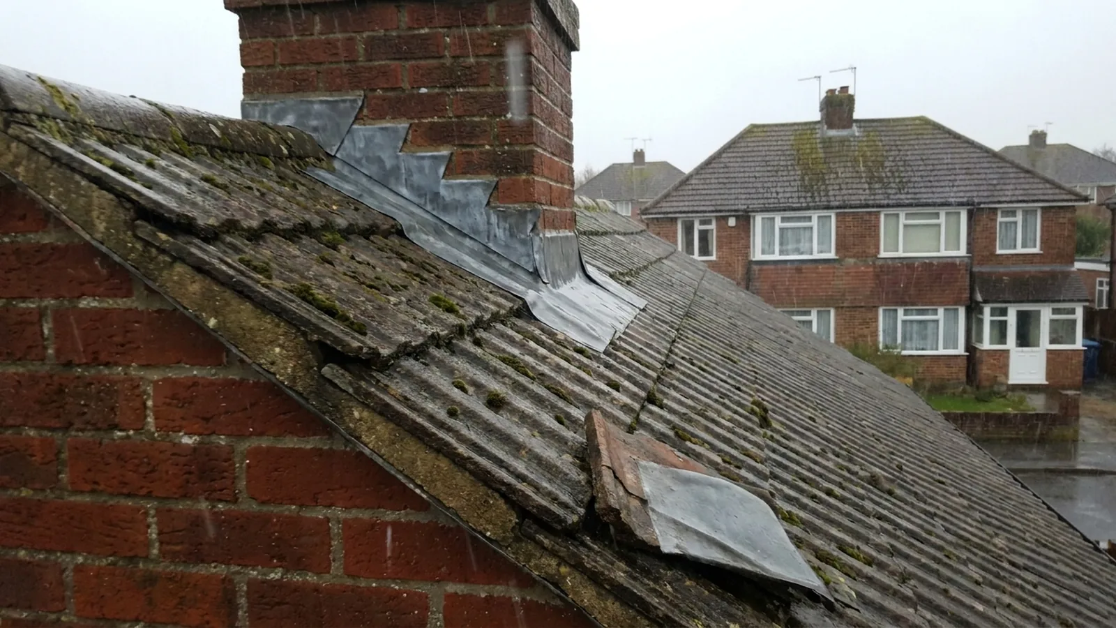 Rain driving against a roof in wind