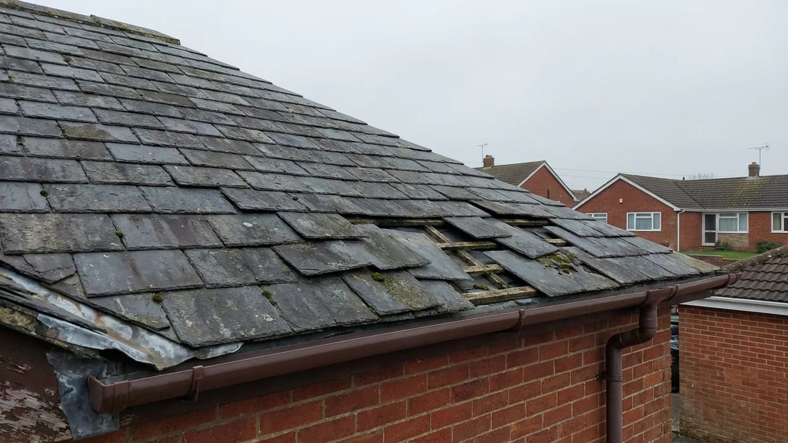 Slates slipped out of line on a roof