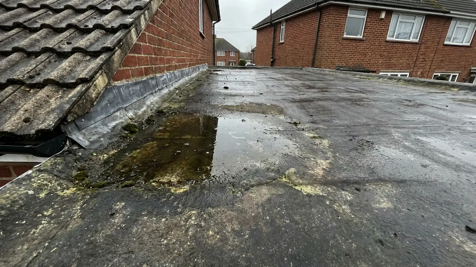 Water pooling on a fibreglass roof