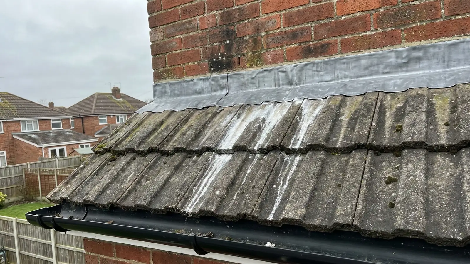 White streaks running down tiles below new lead